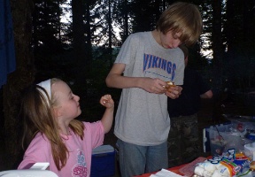 Elsa and Tuomas having smores for dessert
